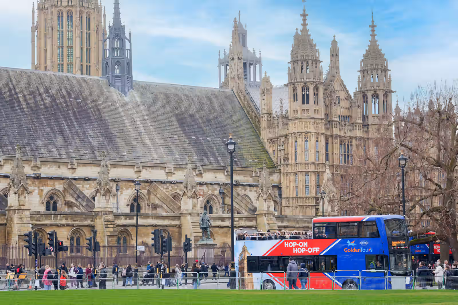 An image of the Golden Tours Hop on Hop Off bus driving past a church in London